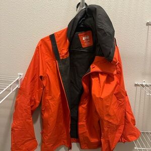REI Woman’s Vibrant Orange/ pink Raincoat